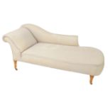 A Victorian oak chaise longue for reupholstery, raised on turned legs, brass capped on castors,