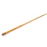 A Victorian faux blonde tortoiseshell walking cane, with a gilt brass mount, foliate engraved and