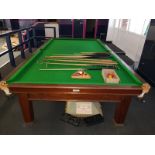 A full size mahogany and slate bed snooker table, 86cm H, 380cm W, 202cm D, together with over