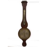 An early 19thC mahogany wheel barometer, with broken arch pediment, floral marquetry roundel over