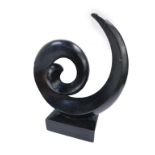 A contemporary black granite Aural Sculpture, of abstract stylised spiral form, on integral