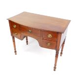 A George IV mahogany bow fronted dressing table, with one long and four short drawers, raised on