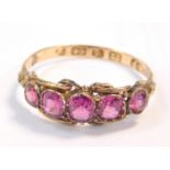 A Victorian 12.5ct gold and amethyst five stone ring, size O, Birmingham 1862, 1.7g all in.
