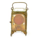 A late Victorian Palais Royale gilt metal framed bevel glass pocket watch cabinet, with swing handle