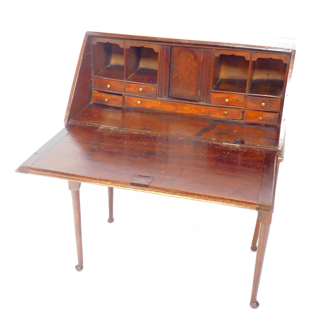 A George II oak bureau on stand, the fall flap opening to reveal an inlaid central door, flanked - Image 2 of 4