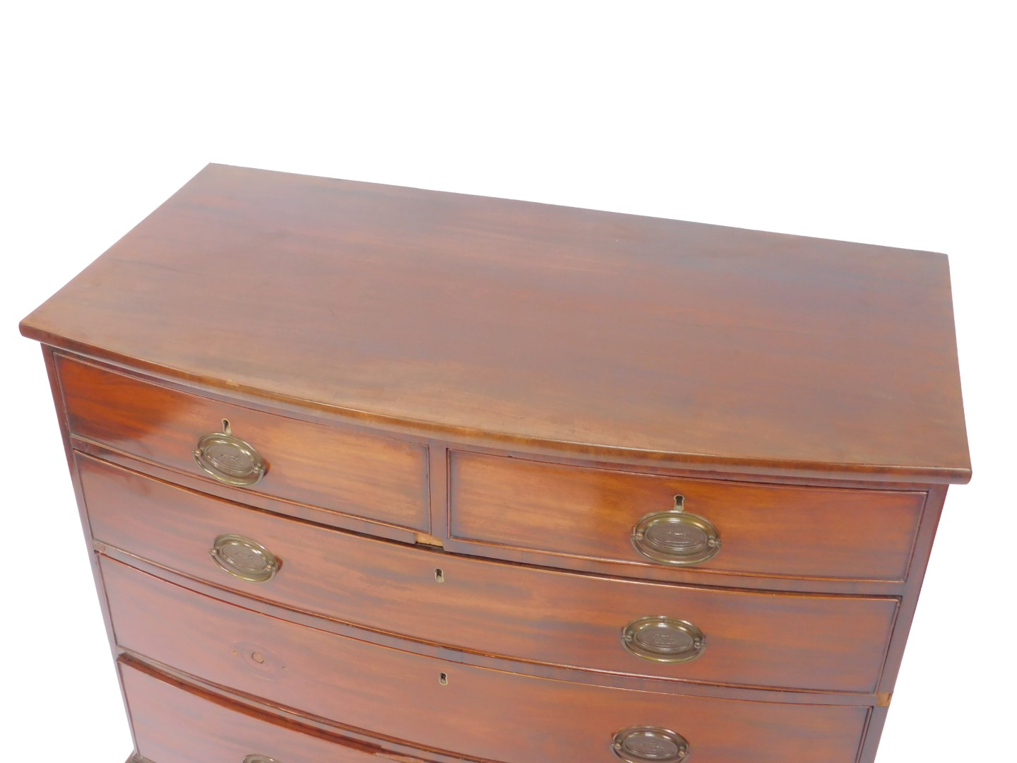 A George III mahogany bow front chest of drawers, of two short over three long drawers, raised on - Image 2 of 5