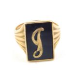 A 9ct gold and black onyx gentleman's signet ring, initialled engraved, size U, 6.0g.