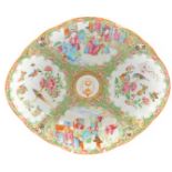 A Quin Dynasty famille rose export dish, of fluted oval form, printed with a crest and motto, COELUM