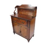 A Regency mahogany secretaire cabinet, with nulled and flamed back with half lyre supports and a