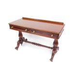 A Victorian mahogany side table, with two frieze drawers raised on turned fluted columns over