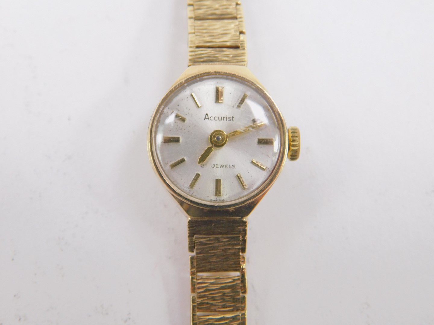 An Accurist lady's 9ct gold wristwatch, silvered dial with gold batons, on a textured gold bracelet, - Image 2 of 3
