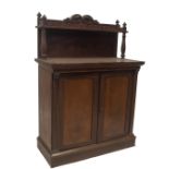 An early Victorian mahogany chiffionier, with scroll carved and castellated gallery, on carved