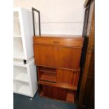 A late 20thC Avalon teak and black metal wall mounted shelf stacking system, having two cupboards