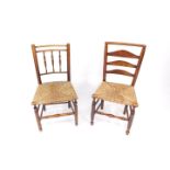 A 19thC oak and rush seated ladder back chair, raised on turned legs united by turned stretchers,