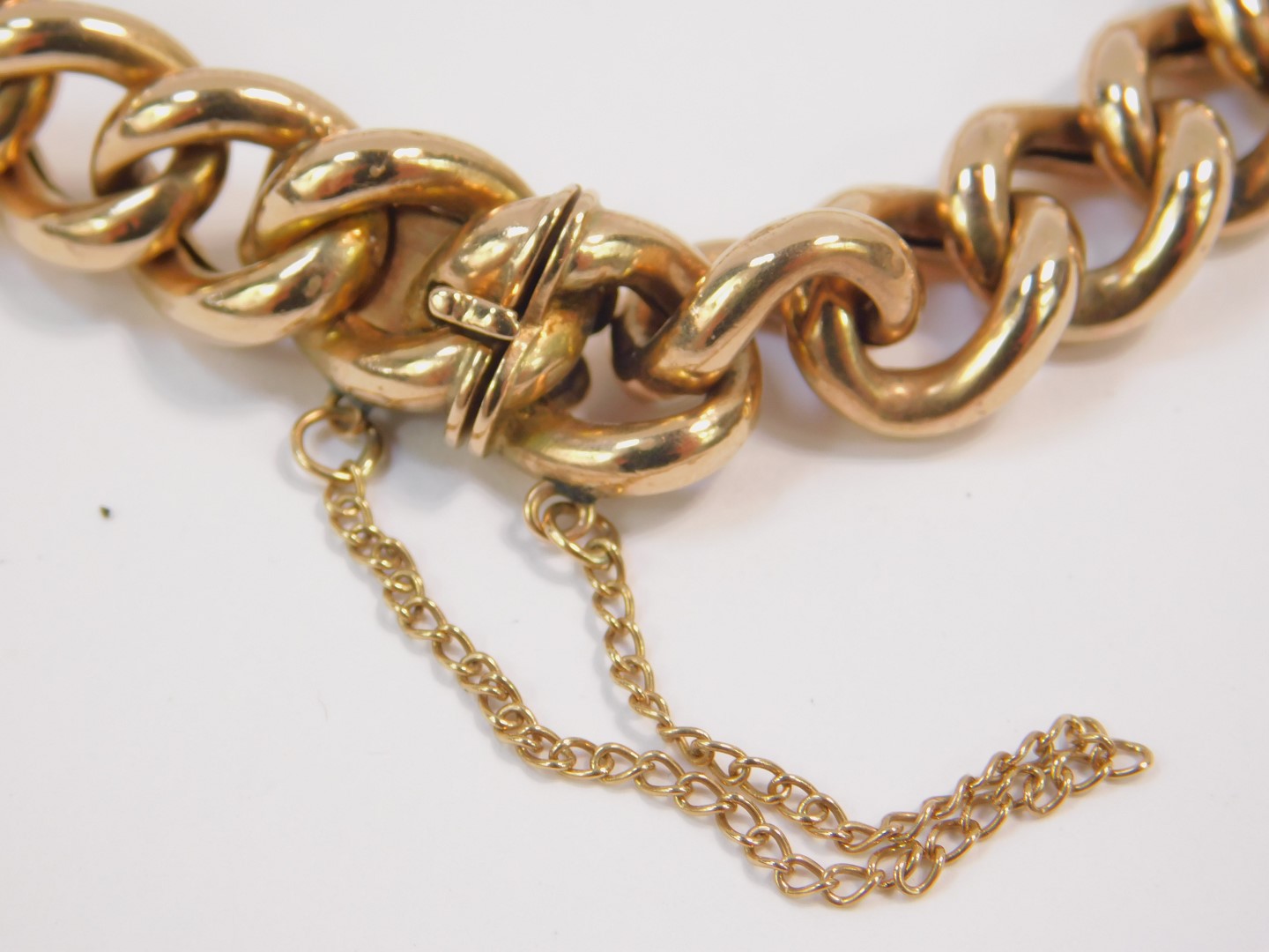 A 9ct gold curb link bracelet, on a snap clasp with safety chain as fitted, 19.2g. - Image 2 of 2