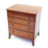 A George III mahogany bachelors chest, with a brushing slide, over four long graduated drawers,