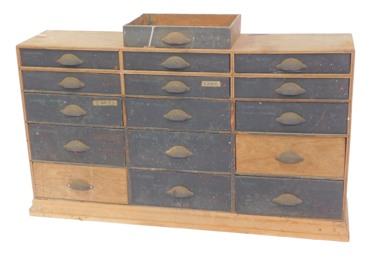 A Victorian pine tool chest, of fifteen graduated drawers, with cast iron handles, raised on a