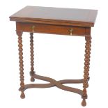 A 17thC style oak fold over card table, with a single frieze drawer raised on bobbin turned supports