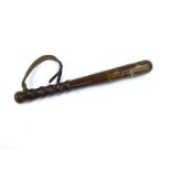 A turned oak police truncheon, bears GR Cipher and Crown, with leather strap, 39cm L.