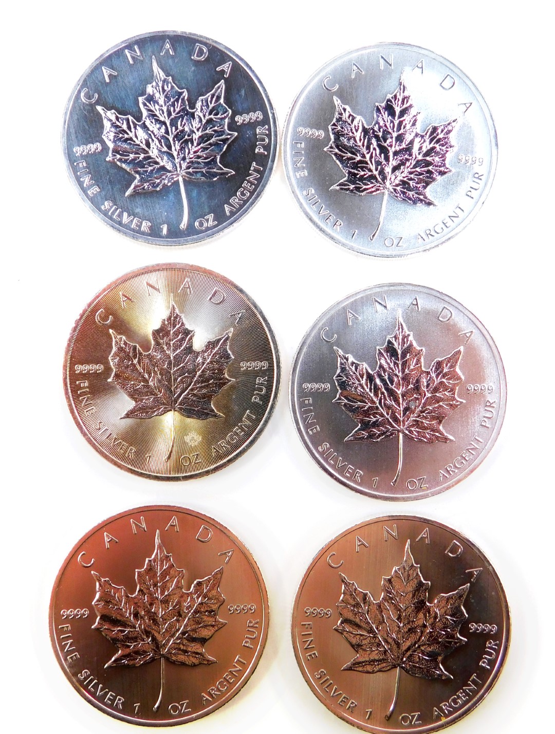 Six Canadian silver Maple Leaf Five dollar coins.