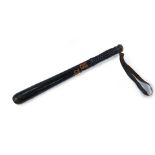 A Victorian ebonised police truncheon, bears Royal Cipher and Crown, with turned handle and