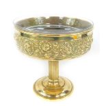 An early 20thC brass table centrepiece or tazza, having a star cut circular clear glass insert bowl,