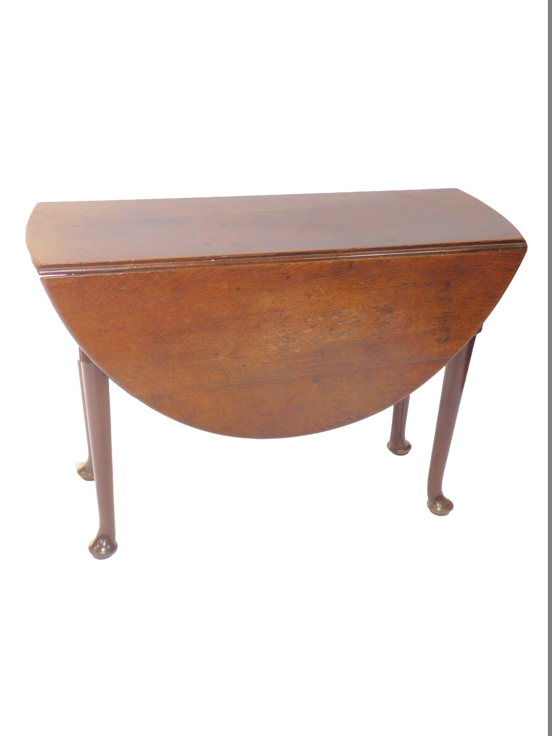 A George III oak drop leaf dining table, raised on turned legs and pad feet, 73cm H, 105cm W, 36cm