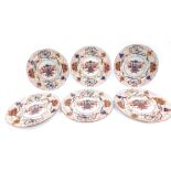An early 19thC set of six Spode porcelain Imari plates, decorated with a vase of flowers within a