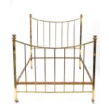A late Victorian brass bed, with turned finials, upright rails, on ceramic castors, 149cm H, 141cm