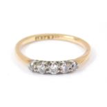 An 18ct gold platinum and diamond five stone ring, approximately 0.15cts, size M, 2.0g.