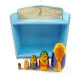 A set of five Indian Beatrix Potter Matryoshka wooden dolls, together with a blue painted Peter