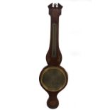 An early 19thC mahogany wheel barometer, with broken arch pediment, floral marquetry roundel over
