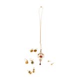 An Art Nouveau 9ct gold and red tourmaline on chain, a pair of 9ct gold single stud earrings, and