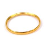 A 22ct gold wedding band, size N, 1.5g.