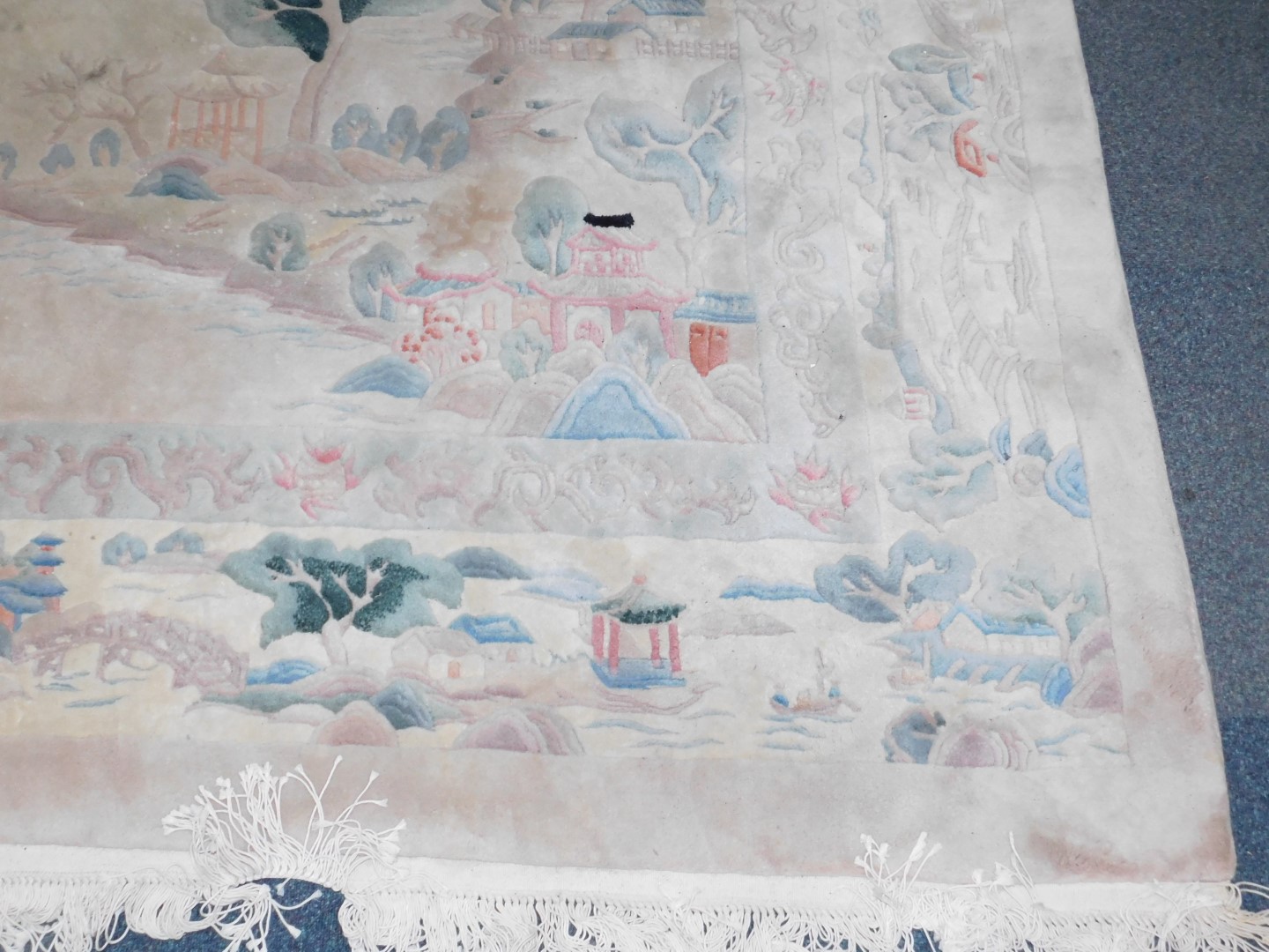 A Chinese rug decorated with a landscape, against a cream ground, 384cm x 275cm. - Image 3 of 3