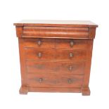 A Victorian flame mahogany Cumberland chest, the break front top with shaped cushion drawer, over