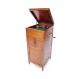An Edwardian mahogany cased cabinet gramophone, of rectangular section, the lift up top opening to