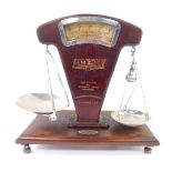 A set of early 20thC W & T Avery Ltd grocery scales, Regd no.694226, metal with a faux wood