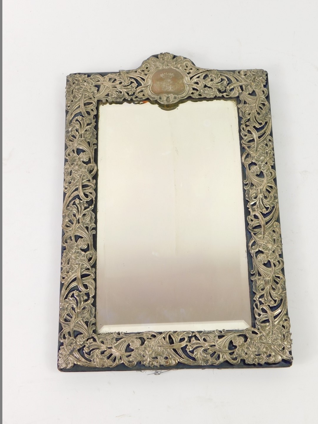 An Edwardian silver mounted rectangular dressing mirror, the frame decorated with Art Nouveau