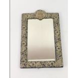 An Edwardian silver mounted rectangular dressing mirror, the frame decorated with Art Nouveau