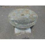 A mill grinding stone, 77cm Dia, on a staddle stone base, 40cm H.