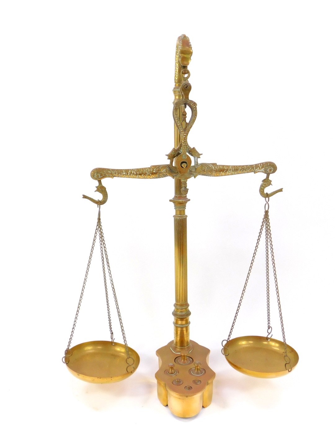 A pair of Victorian brass beam scales, with cast dolphin suspension, fluted column, raised on a