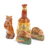 Three Beswick Beneagles Scotch Whisky decanters, comprising a brown bear and two otters, each