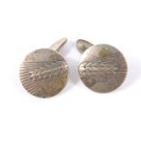 A pair of silver cuff links, of circular form, cast and engraved with corn, marked Georg Jensen,