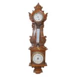A Victorian oak cased clock and barometer, with thermometer, the case of carved classical