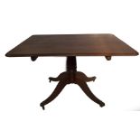 A Regency mahogany breakfast table, with moulded rectangular tilt top, with brass anchor handle, the