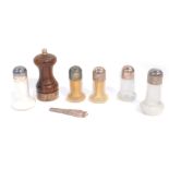 A turned wooden and silver pepperette, London 1984, five Cristofle glass salt and pepper pots,