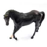 A Beswick matt black pottery figure modelled as Black Beauty, printed mark.