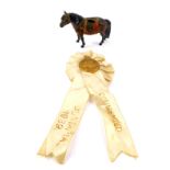 An International Horse Show medallion rosette, Commended, Olympia 1939, together with a cold painted