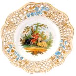 A late Meissen plate, painted with figures etc, with pierced gilt borders impressed Meissen to